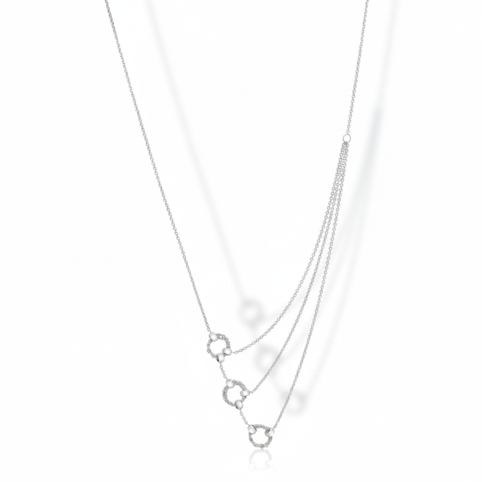 Asymmetrical handmade Italian 925 silver crochet rings necklace, rhodium plated, displayed hanging.