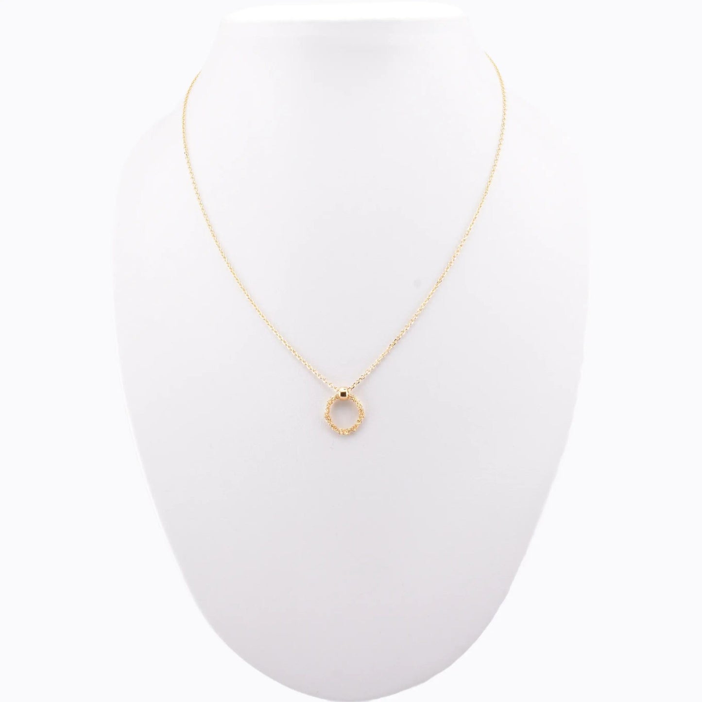 Minimalist handmade Italian 925 silver crochet ring necklace, gold plated, displayed on jewelry stand.