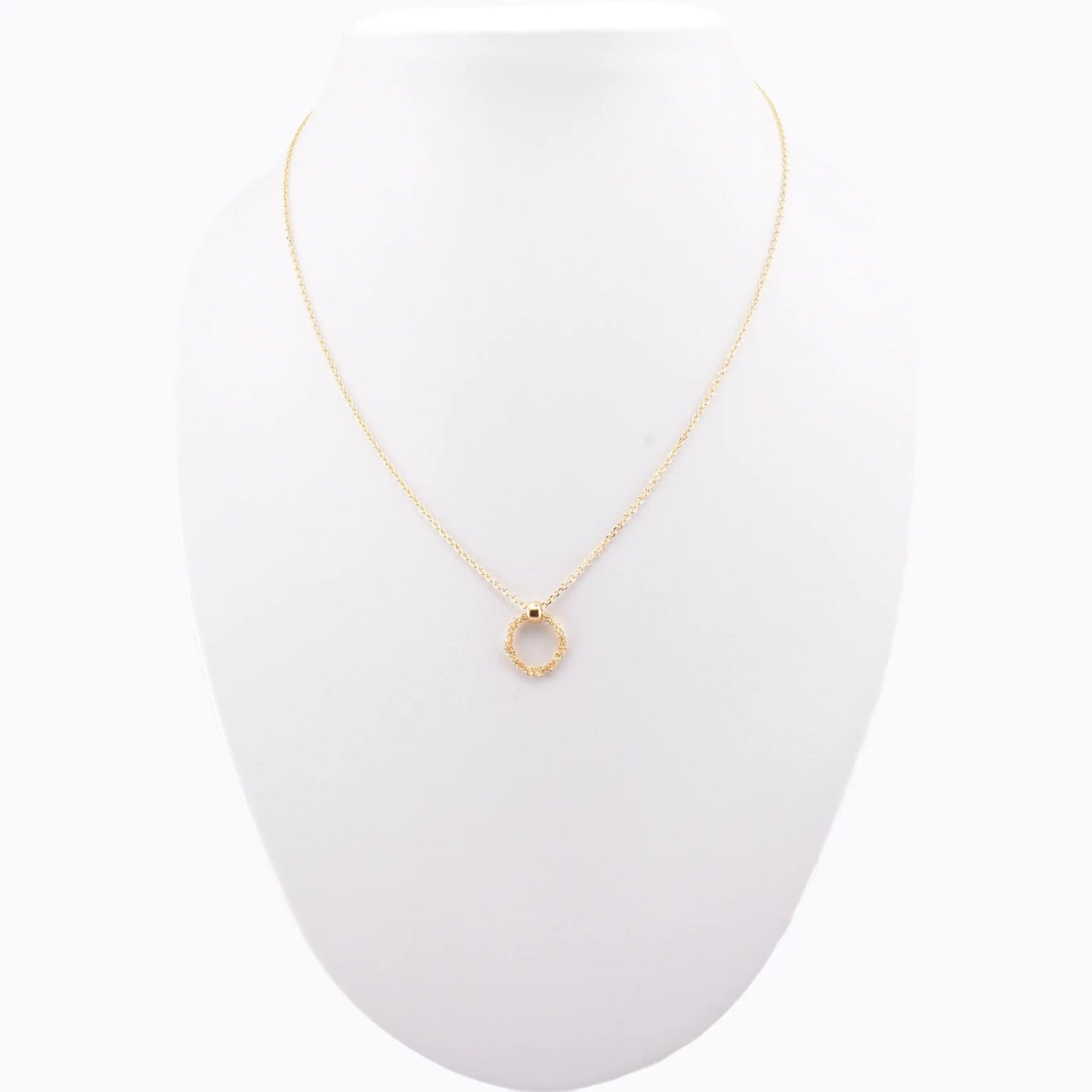 Minimalist handmade Italian 925 silver crochet ring necklace, gold plated, displayed on jewelry stand.