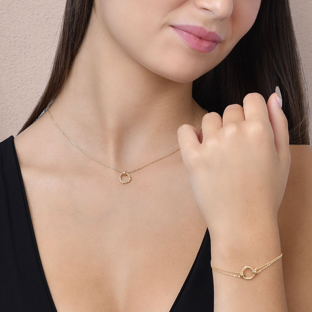 Model wearing minimalist handmade Italian 925 silver necklace with a central crochet ring.